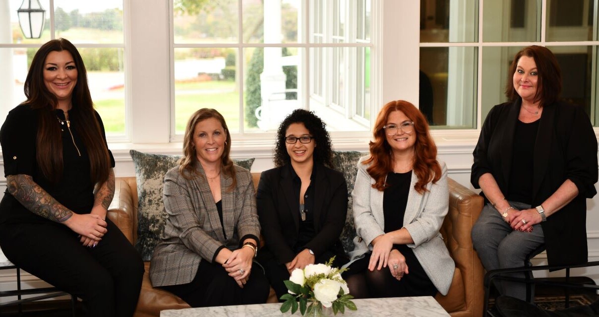 a group of people sitting on a couch