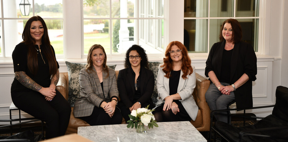 5 women sitting down