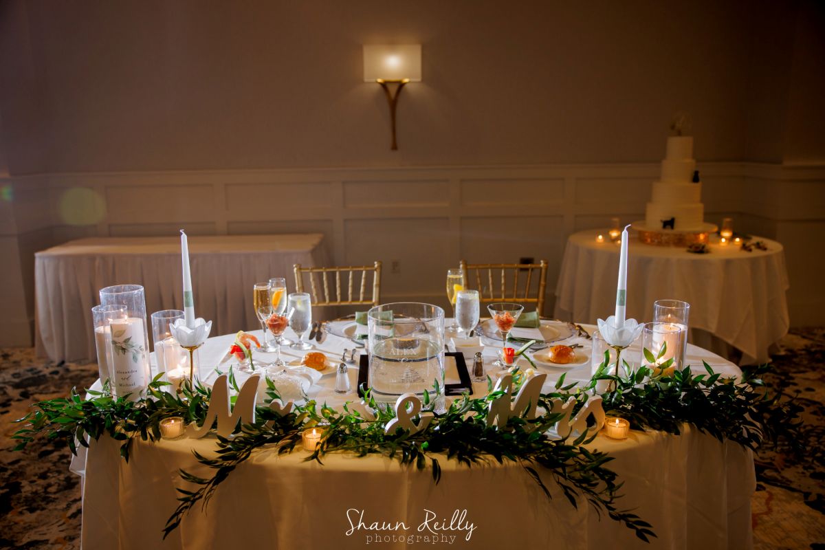 a table with candles and flowers